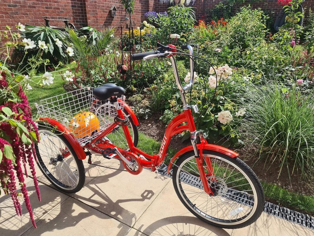 Red Scout adult folding tricycle with 24" wheels, 6-speed gears and rear shopping basket